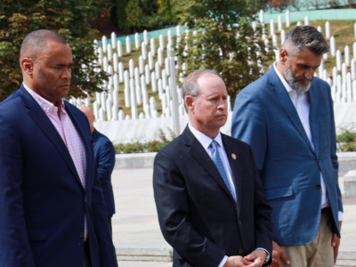 Representatives Murphy, Veasey, and the director of the Srebrenica Memorial Center lay a wreath at a memorial for victims of the Srebrenica genocide