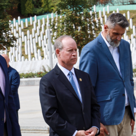 Representatives Murphy, Veasey, and the director of the Srebrenica Memorial Center lay a wreath at a memorial for victims of the Srebrenica genocide
