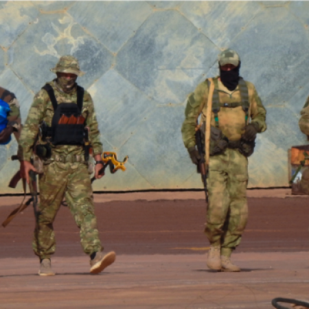 This undated photograph handed out by French military shows three Russian mercenaries right in northern Mali 