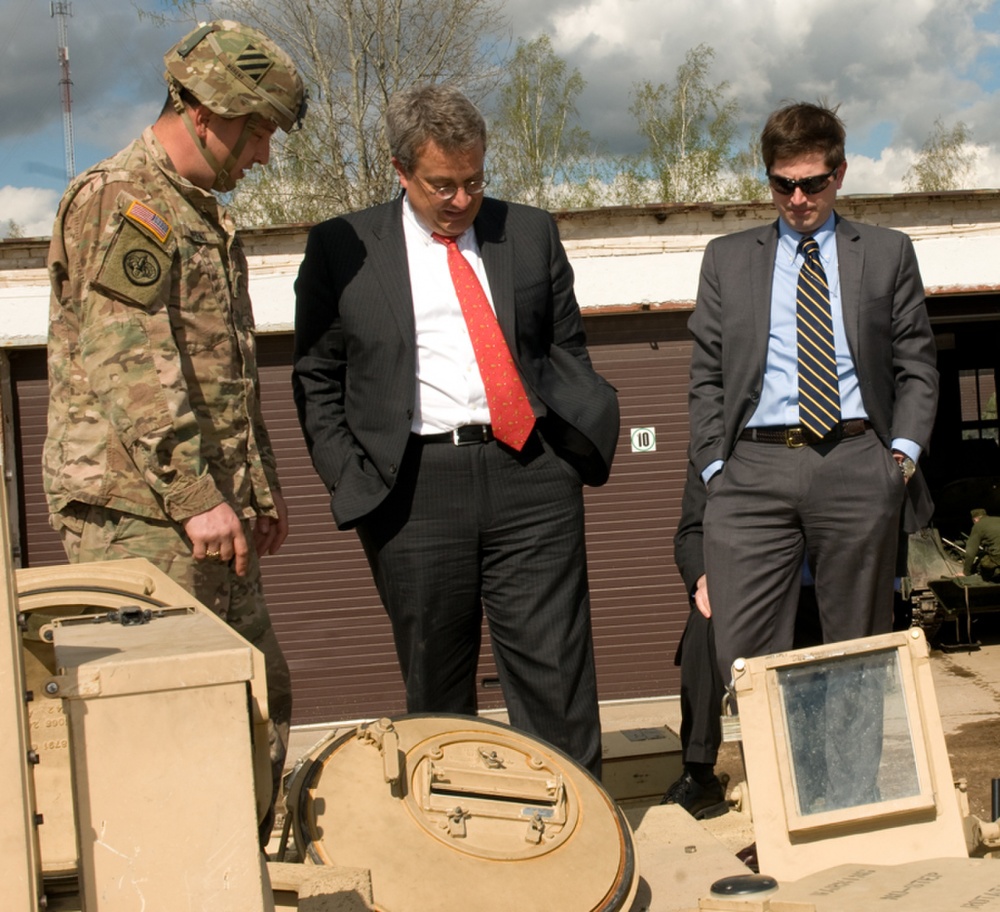 Former Ambassador David Killion, Senior Senate Staff Representative for the U.S. Commission on Security and Cooperation in Europe, talks with Lt. Col. Mantas Paskevicius, the chief of staff of Iron Wolf Brigade, Lithuanian army, at the Iron Wolf headquarters in Rukla, Lithuania, April 29, 2015